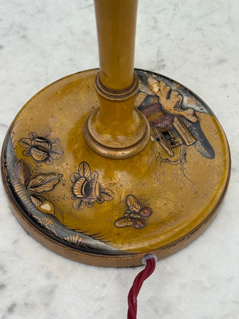 An antique ochre yellow lacquered table lamp featuring hand-painted Chinoiserie motifs and a cream scalloped lampshade. View III