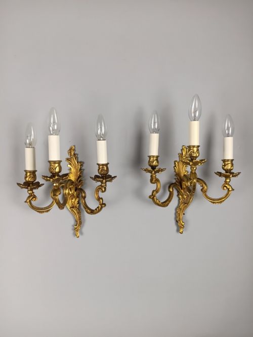 PAIR OF FRENCH ANTIQUE TRIPLE ARM ROCOCO GILDED BRONZE WALL LIGHTS
