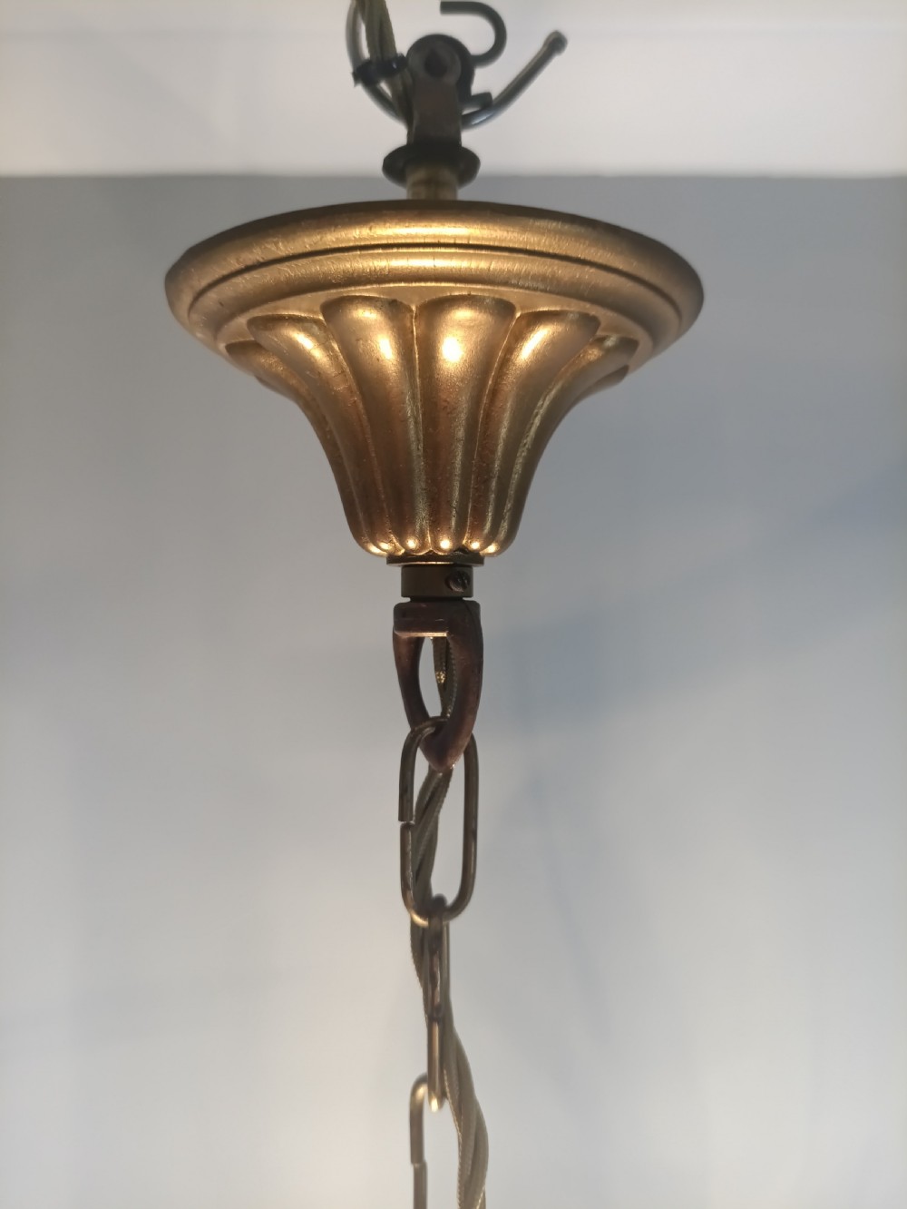 A cylindrical French gilt brass hall lantern with etched curved glass panels housing a three-bulb candle fitting. View IX