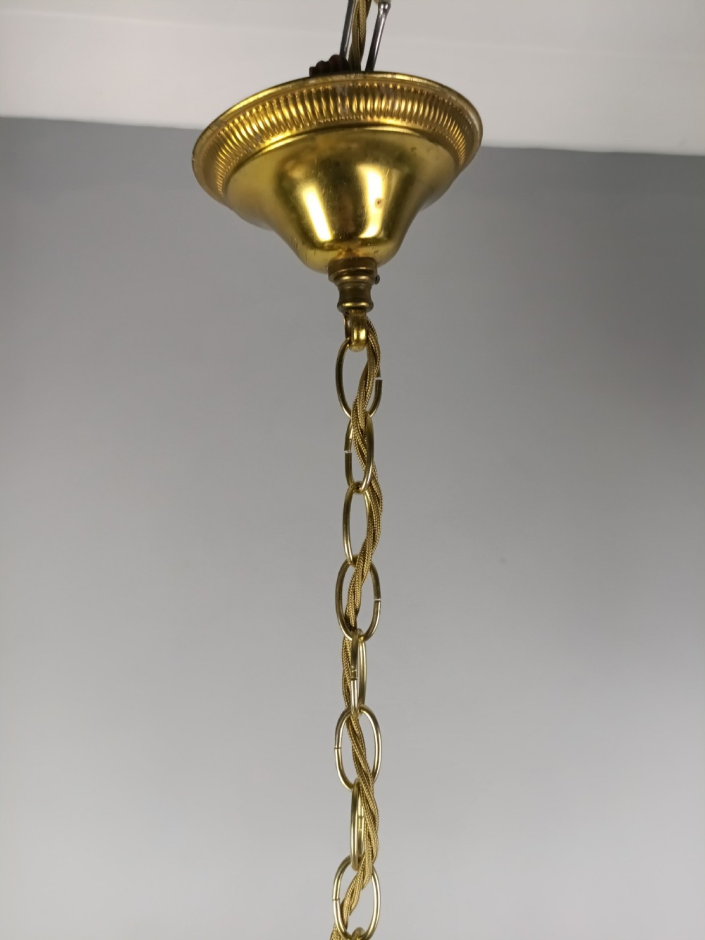 A French gilded metal three-arm birdcage chandelier with hanging clear crystal droplets and glass rosette accents. View VII