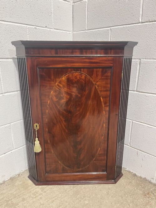 A Georgian Inlaid Mahogany Corner Cupboard