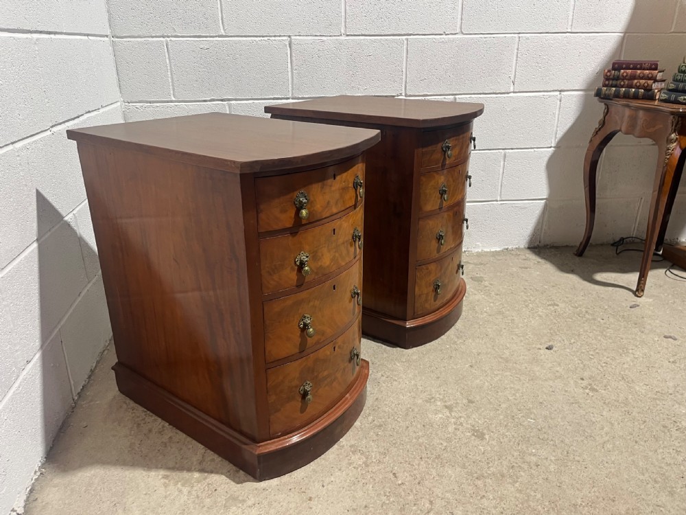 A pair of 19th-century mahogany bedside chests with curved bowfront drawers and ornamental brass drop handles. View VIII