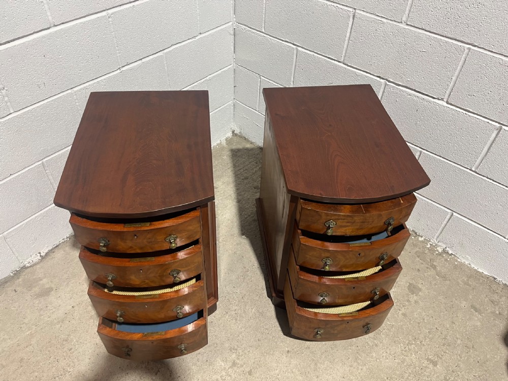 A pair of 19th-century mahogany bedside chests with curved bowfront drawers and ornamental brass drop handles. View IX