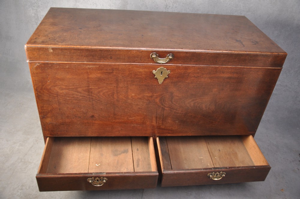 An 18th-century mahogany silver chest featuring a hinged lid, twin base drawers, side carrying handles, and bracket feet. View III