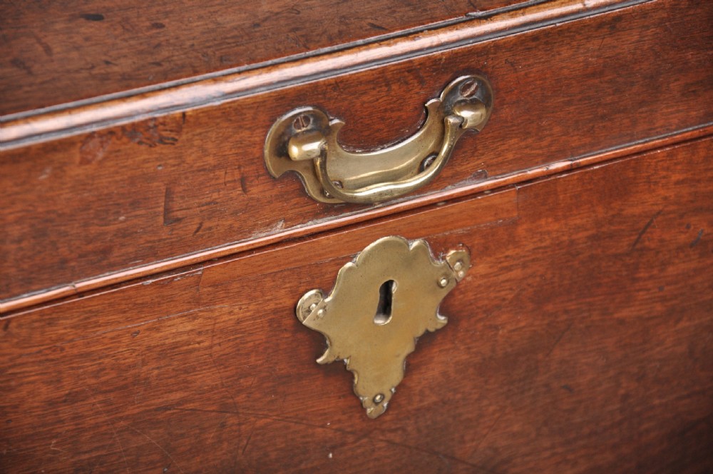 An 18th-century mahogany silver chest featuring a hinged lid, twin base drawers, side carrying handles, and bracket feet. View IV