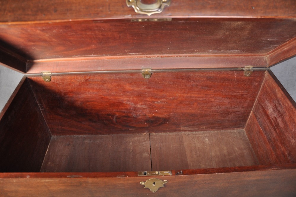 An 18th-century mahogany silver chest featuring a hinged lid, twin base drawers, side carrying handles, and bracket feet. View IX