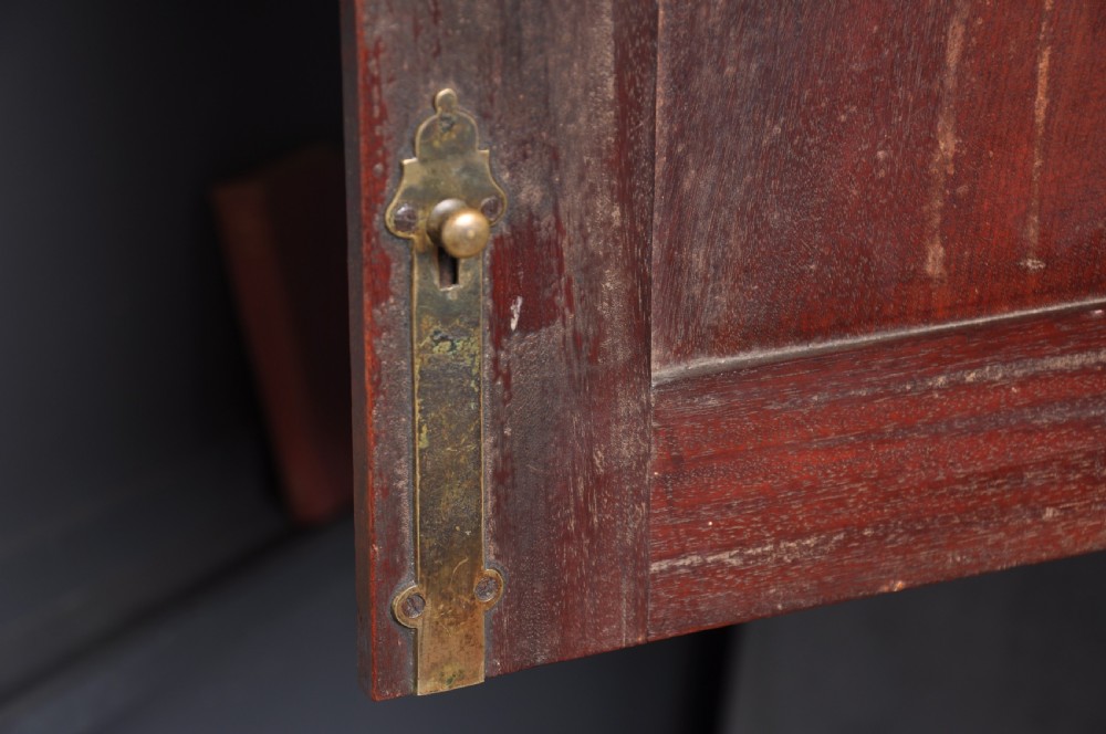 An 18th-century mahogany bureau bookcase featuring a blind two-door upper cabinet, a slant-front writing slope, four long drawers, and bracket feet. View VII