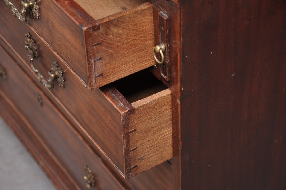 An 18th-century mahogany bureau bookcase featuring a blind two-door upper cabinet, a slant-front writing slope, four long drawers, and bracket feet. View XII