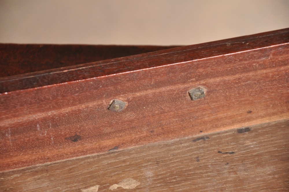 A mid-18th-century mahogany fold-over tea table featuring a single frieze drawer with brass handles and slender cabriole legs ending in pad feet. View VI