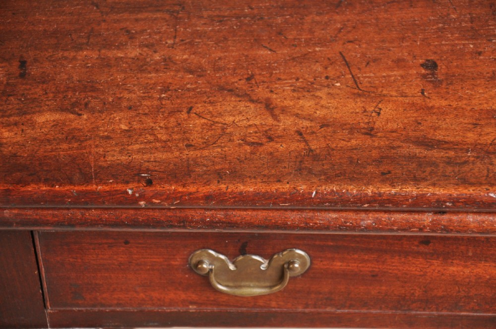 A mid-18th-century mahogany fold-over tea table featuring a single frieze drawer with brass handles and slender cabriole legs ending in pad feet. View XI