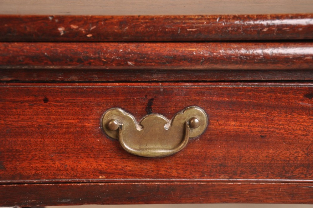 A mid-18th-century mahogany fold-over tea table featuring a single frieze drawer with brass handles and slender cabriole legs ending in pad feet. View XIII