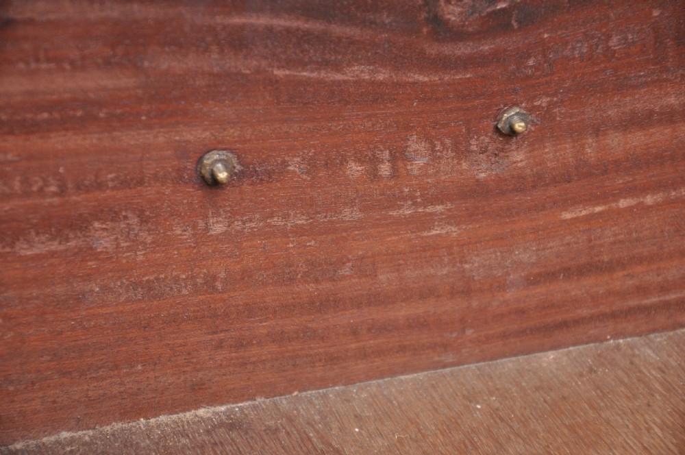 An 18th-century mahogany tallboy featuring two sections of graduated drawers, brass handles, carved blind fretwork frieze, and ogee bracket feet. View VII