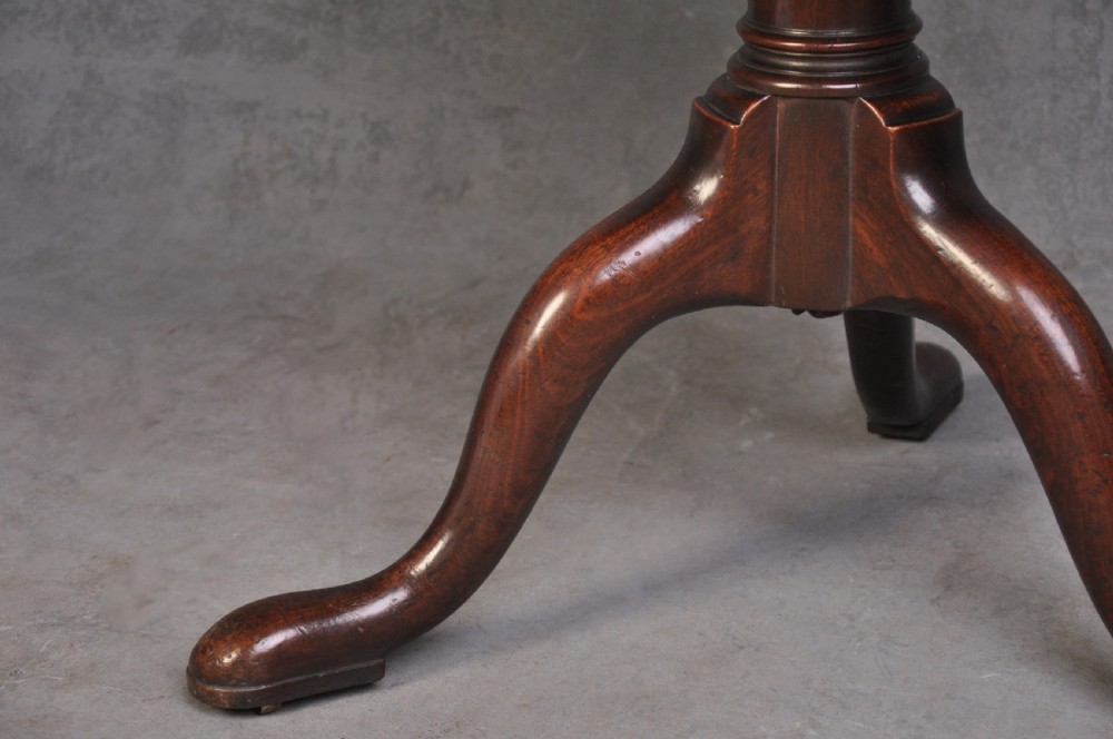 An 18th-century dark mahogany dumb waiter featuring three graduated circular dish trays supported by a turned central column on tripod cabriole legs. View II