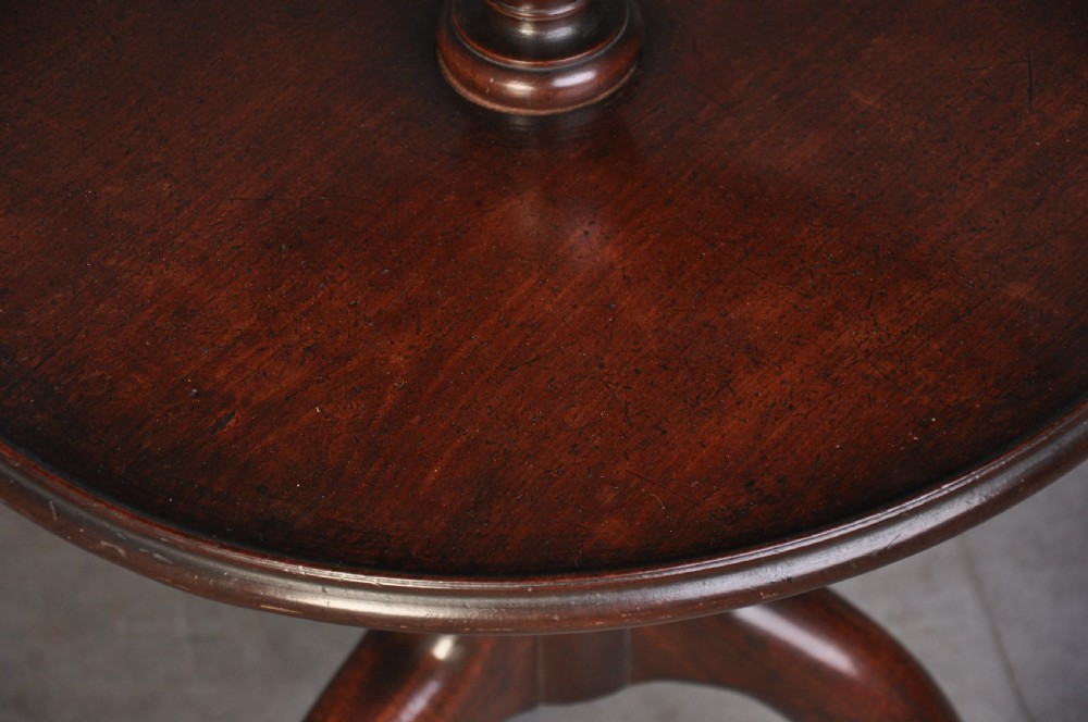 An 18th-century dark mahogany dumb waiter featuring three graduated circular dish trays supported by a turned central column on tripod cabriole legs. View III