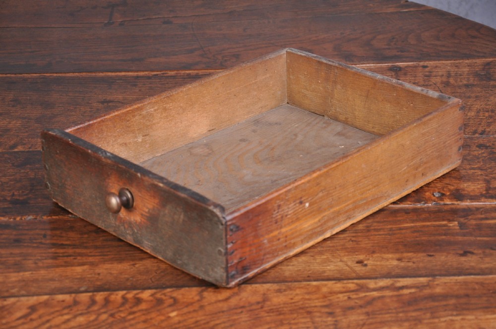 A seventeenth-century oak gateleg table shown with drop leaves folded down, featuring turned legs and low box stretchers. View V