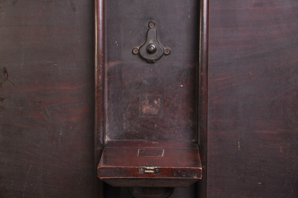 An 18th-century mahogany tripod table featuring a circular top resting on a turned column with a spiral carved knop and three cabriole legs terminating in pad feet. View VI