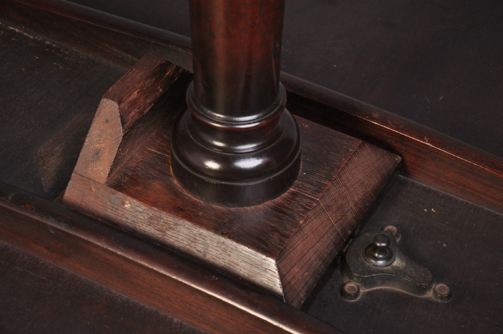 An 18th-century mahogany tripod table featuring a circular top resting on a turned column with a spiral carved knop and three cabriole legs terminating in pad feet. View VII