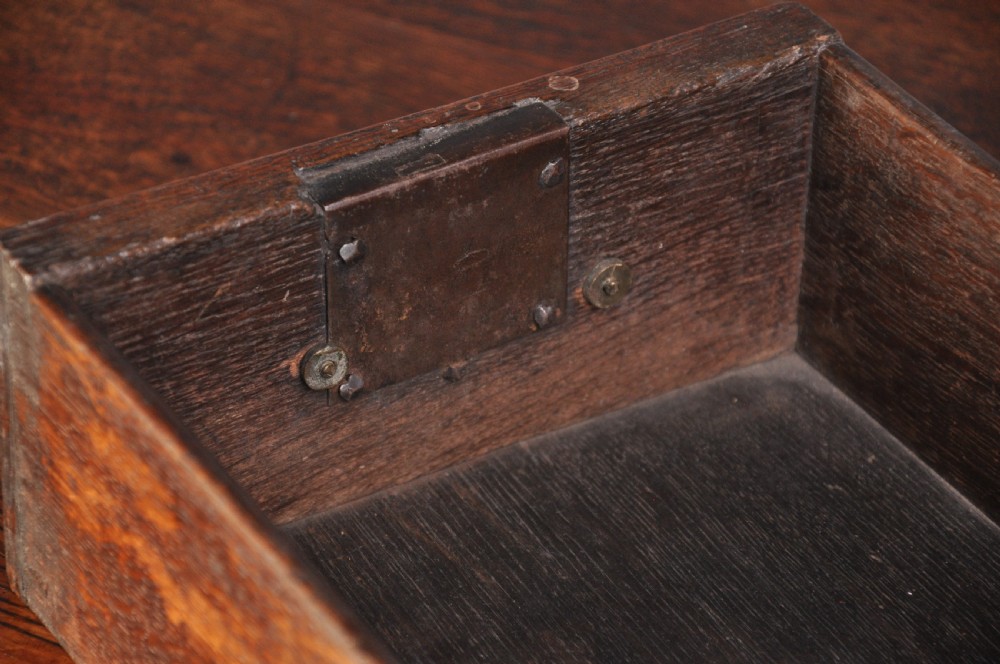 An 18th-century oak lowboy table featuring three inlaid drawers, brass swan-neck handles, an arched apron, and cabriole legs. View IV