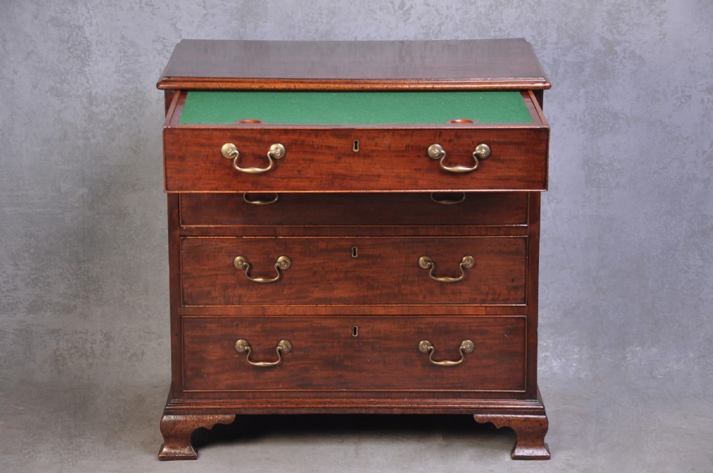 An 18th-century mahogany dressing chest featuring four graduated drawers with brass swan-neck handles and bracket feet. View III