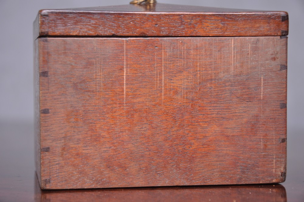 An 18th-century mahogany dressing chest featuring four graduated drawers with brass swan-neck handles and bracket feet. View X