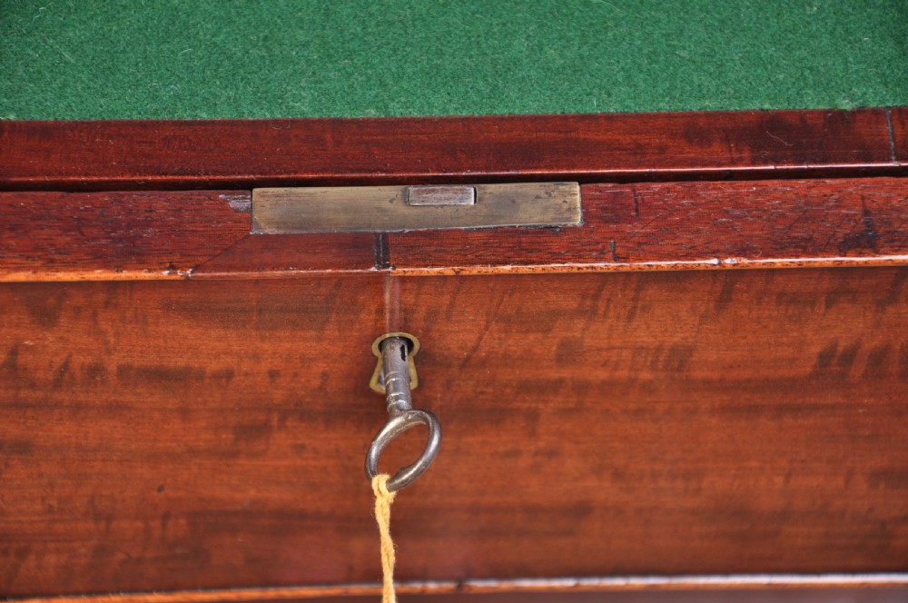 An 18th-century mahogany dressing chest featuring four graduated drawers with brass swan-neck handles and bracket feet. View XII