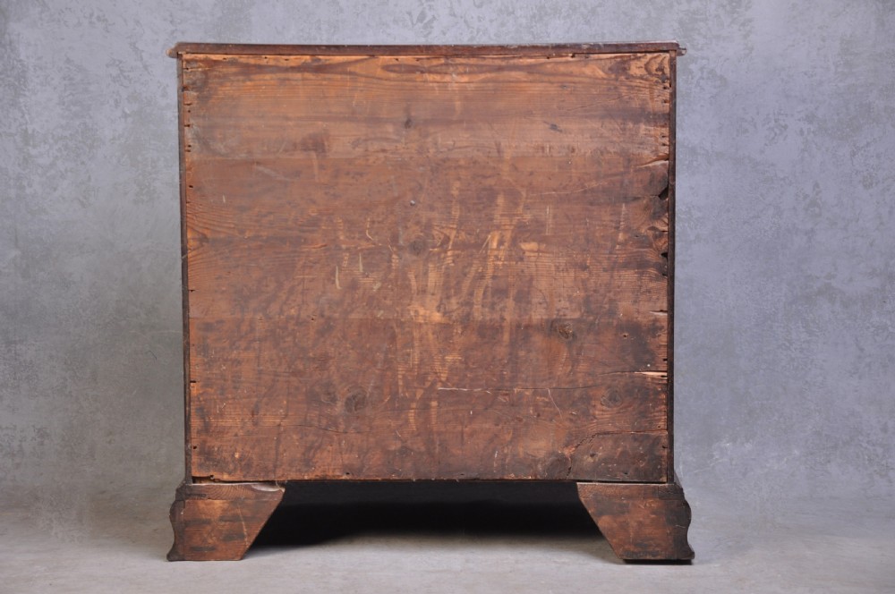 An 18th-century mahogany dressing chest featuring four graduated drawers with brass swan-neck handles and bracket feet. View XIII