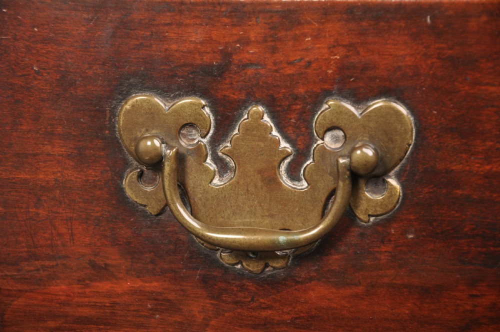 An 18th-century cherrywood lowboy featuring three drawers with brass batwing handles, a shaped apron, and cabriole legs with ball-and-claw feet. View II