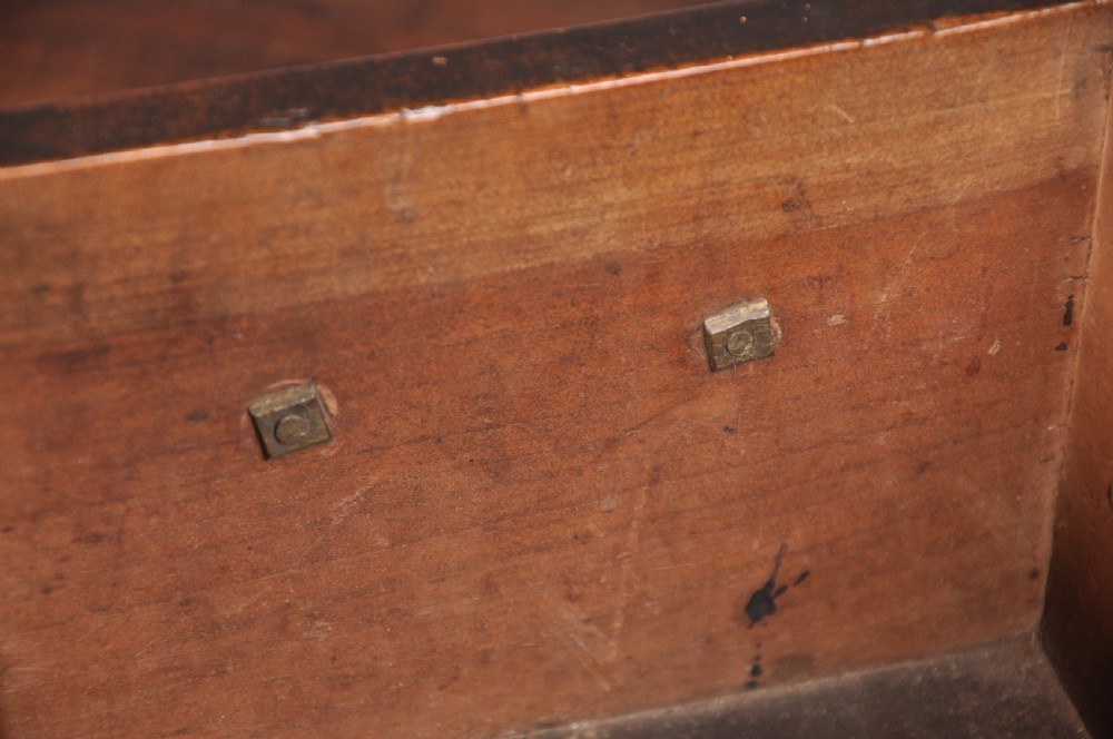 An 18th-century cherrywood lowboy featuring three drawers with brass batwing handles, a shaped apron, and cabriole legs with ball-and-claw feet. View XII