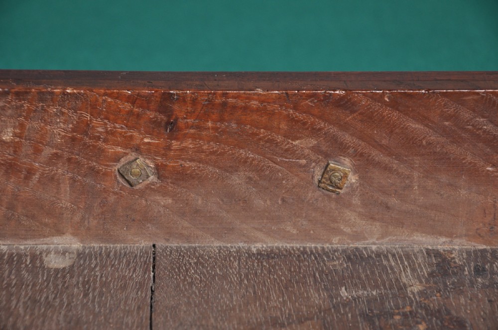 An 18th-century mahogany fold-over card table featuring slender cabriole legs, pad feet, a central drawer with a brass swing handle, and shaped corners. View V