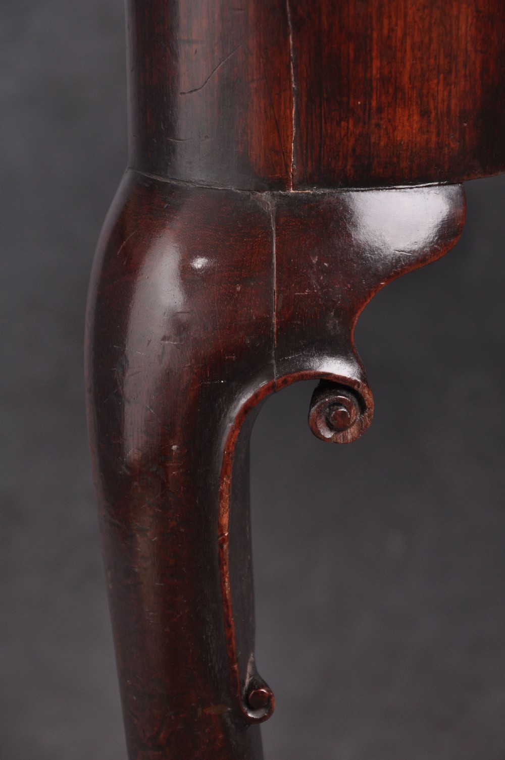 An 18th-century mahogany fold-over card table featuring slender cabriole legs, pad feet, a central drawer with a brass swing handle, and shaped corners. View VII