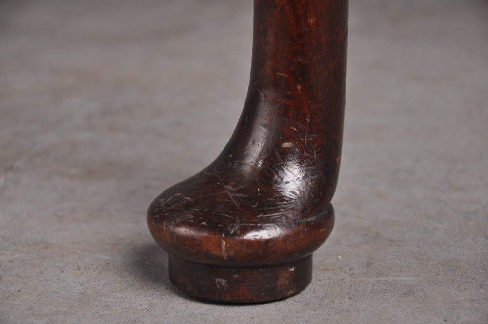 An 18th-century mahogany fold-over card table featuring slender cabriole legs, pad feet, a central drawer with a brass swing handle, and shaped corners. View VIII