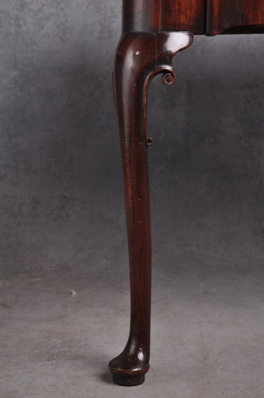 An 18th-century mahogany fold-over card table featuring slender cabriole legs, pad feet, a central drawer with a brass swing handle, and shaped corners. View IX