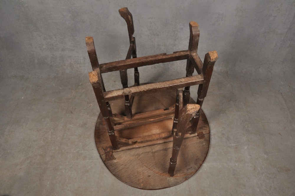 A small dark brown Queen Anne oak gateleg table shown with both drop leaves lowered, featuring turned legs and a stretcher base. View VII