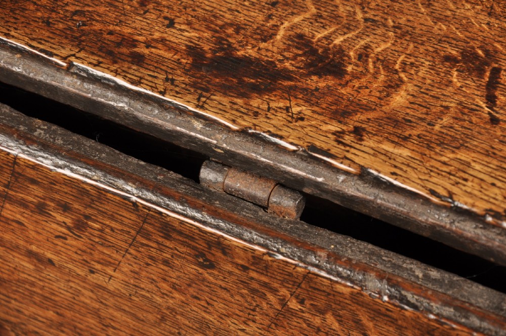 A large 17th-century solid oak gateleg dining table with two drop leaves, turned legs, and square box stretchers. View IV
