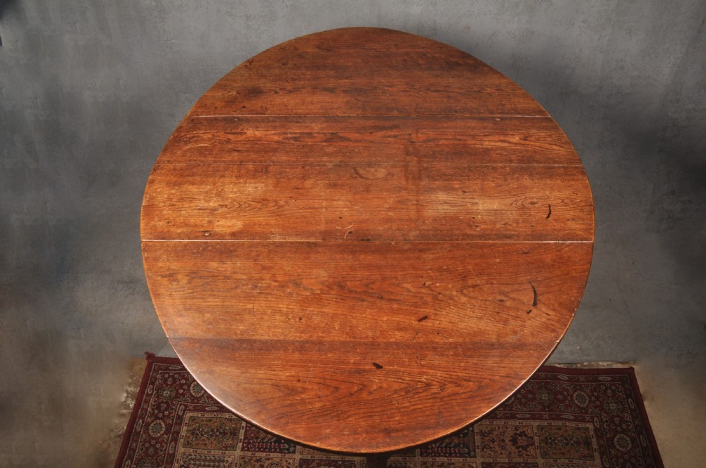 A seventeenth-century oak gateleg dining table featuring hinged drop leaves and turned wood legs with low stretchers. View III