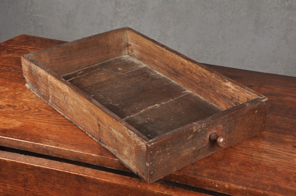 A seventeenth-century oak gateleg dining table featuring hinged drop leaves and turned wood legs with low stretchers. View V
