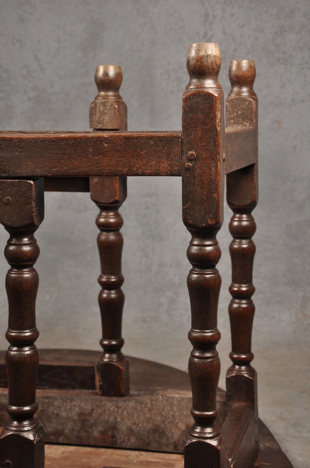 A seventeenth-century oak gateleg dining table featuring hinged drop leaves and turned wood legs with low stretchers. View IX