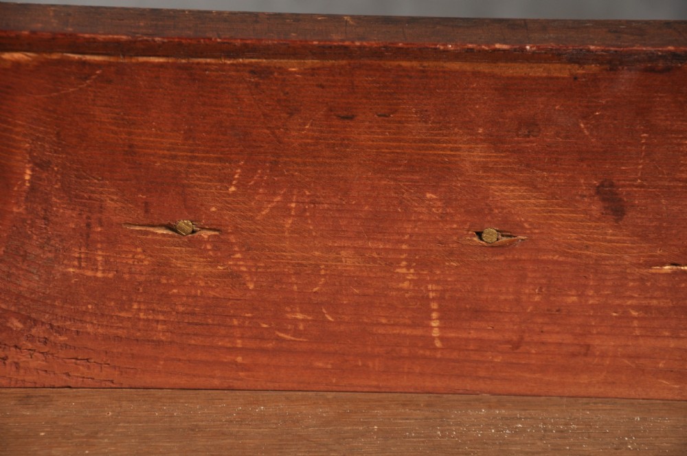 An 18th-century Georgian mahogany chest of drawers featuring four graduated drawers, brass swan-neck handles, a brushing slide, and bracket feet. View VII
