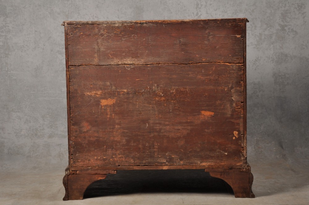An 18th-century Georgian mahogany chest of drawers featuring four graduated drawers, brass swan-neck handles, a brushing slide, and bracket feet. View XI