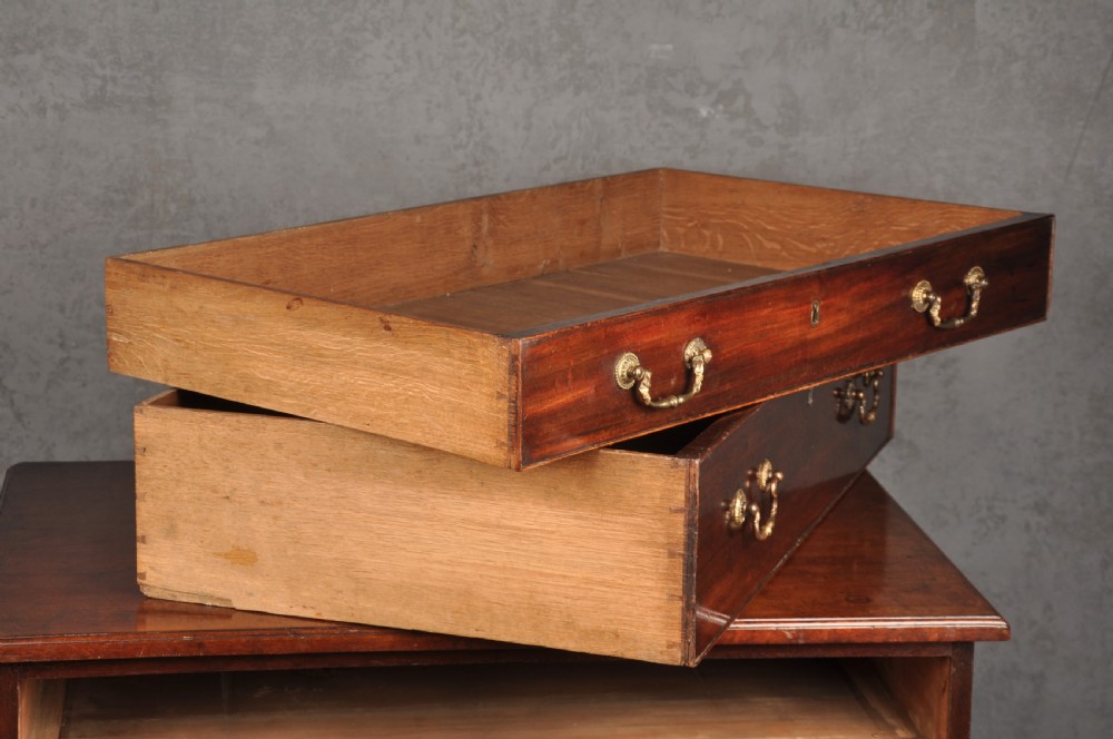 A Georgian mahogany chest featuring four graduated drawers with brass swan-neck handles and bracket feet. View VIII