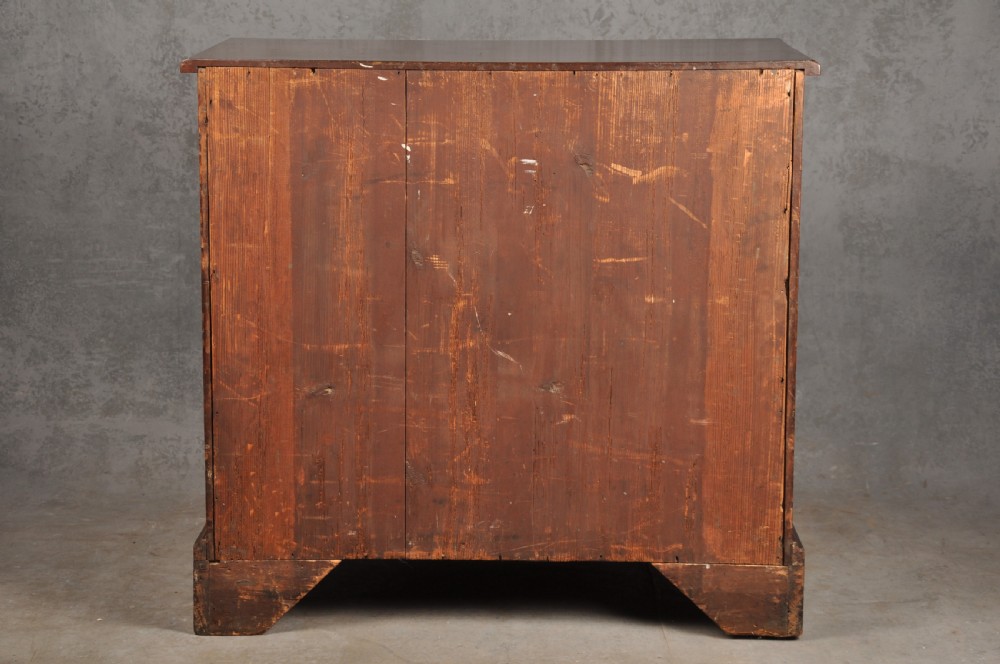 A Georgian mahogany chest featuring four graduated drawers with brass swan-neck handles and bracket feet. View XI