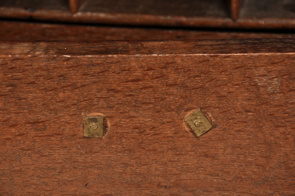 An early 18th-century dark oak bureau bookcase with a two-door upper section, a sloped writing fall, and long drawers on bracket feet. View XIII