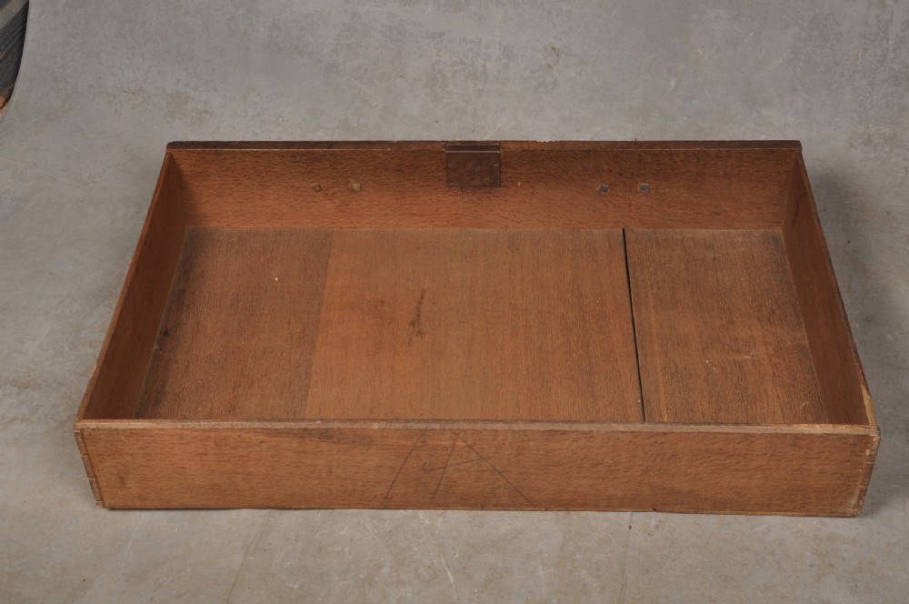 An early 18th-century dark oak bureau bookcase with a two-door upper section, a sloped writing fall, and long drawers on bracket feet. View XVIII
