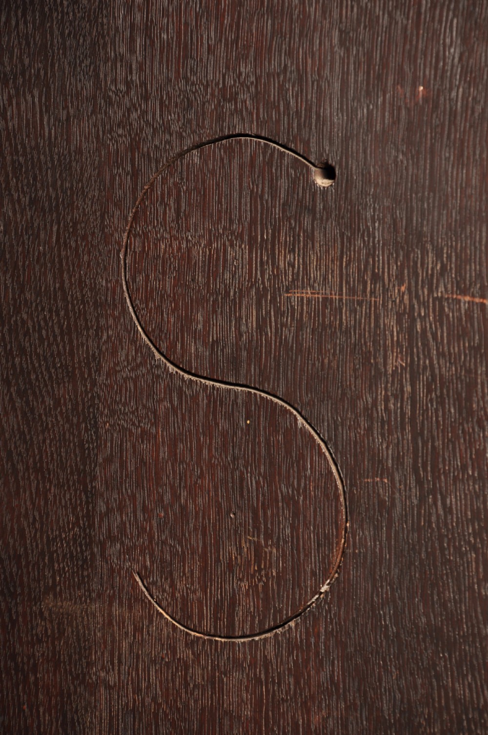 An early 18th-century dark oak bureau bookcase with a two-door upper section, a sloped writing fall, and long drawers on bracket feet. View XX