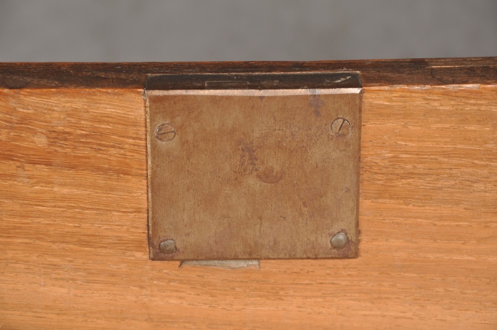 An 18th-century Georgian oak chest of drawers featuring two short drawers over three long drawers with brass drop handles and bracket feet. View XI
