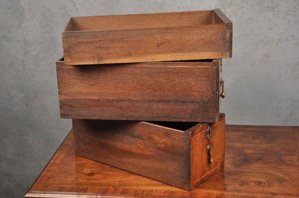 An 18th-century walnut lowboy table featuring three drawers with brass drop handles, a shaped lower apron, and cabriole legs. View VIII