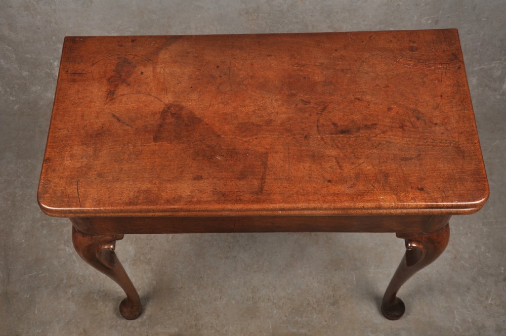 An 18th-century mahogany tea table featuring a folding rectangular top, concertina frame action, and cabriole legs with pad feet. View XI