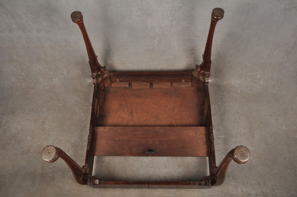 An 18th-century mahogany tea table featuring a folding rectangular top, concertina frame action, and cabriole legs with pad feet. View XII