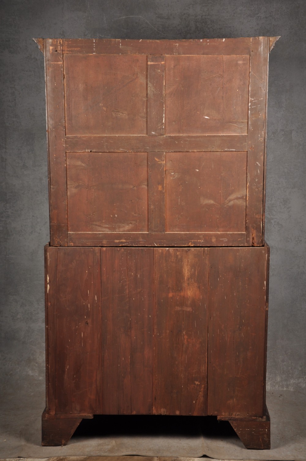 An 18th-century Georgian mahogany tallboy chest-on-chest featuring two stacked sections with brass swan-neck handles, dentil moulding, fluted canted corners, and bracket feet. View XII