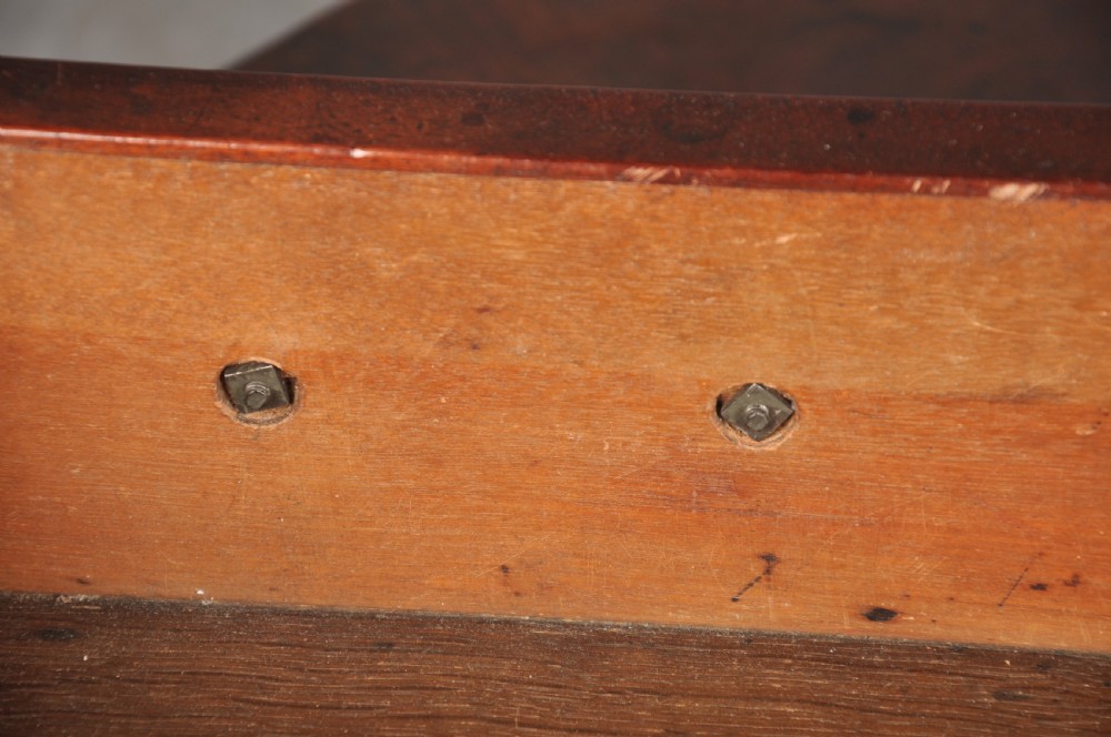 An 18th-century Georgian mahogany kneehole desk featuring brass swan-neck handles, a central recessed cupboard, and bracket feet. View XI